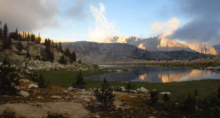 An alpine lake rests among the mountains of the high sierra